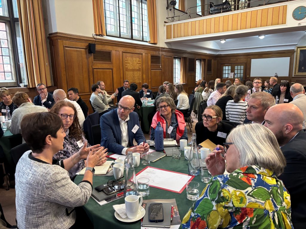 Event attendees discuss the new report on the future of apprenticeships